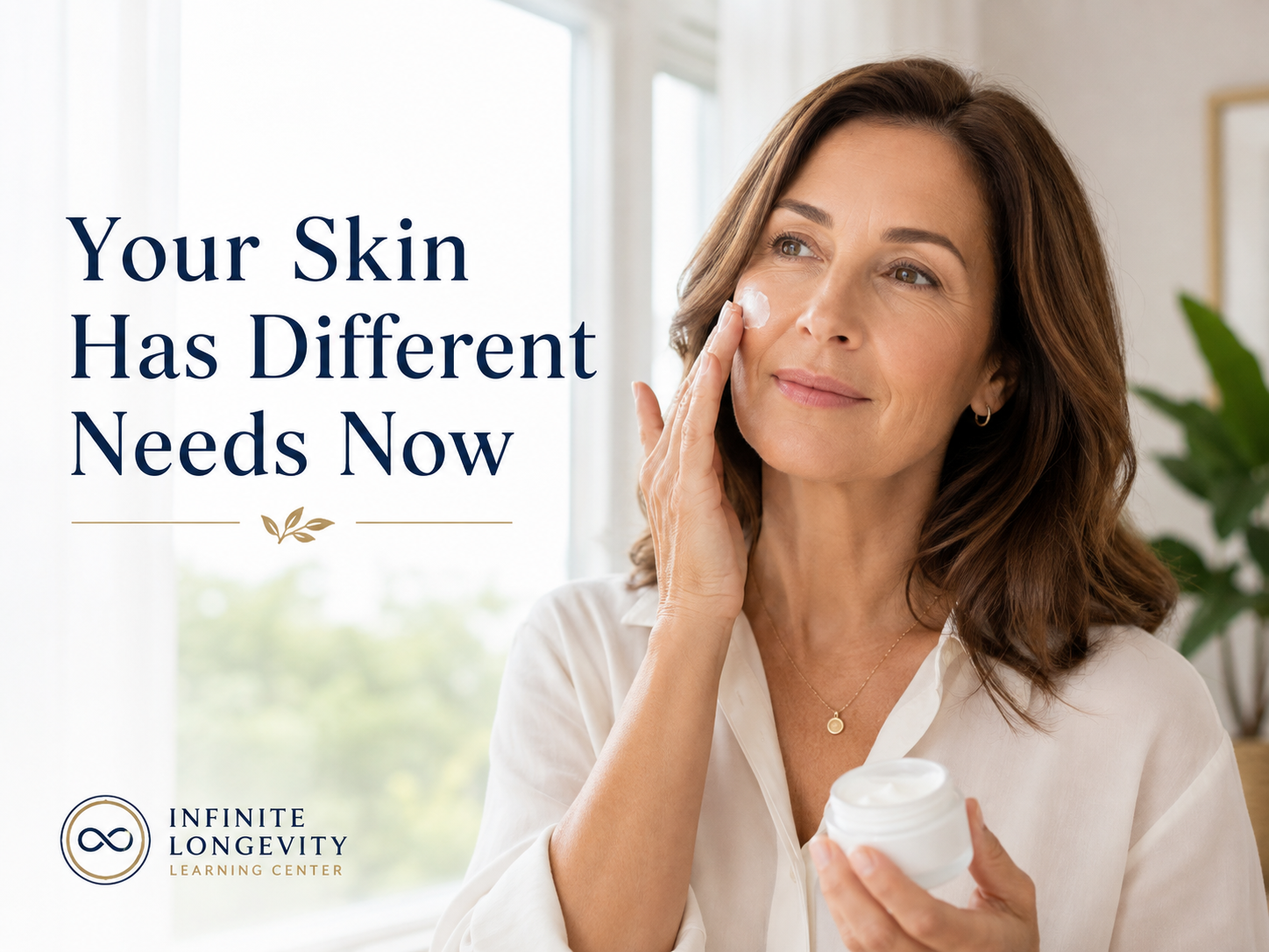 Woman in her 50s applying moisturizer to naturally textured skin as part of a simple daily skin-care routine.