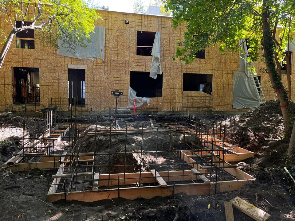 Foundation footing forms and reinforcement prepared for a residential addition