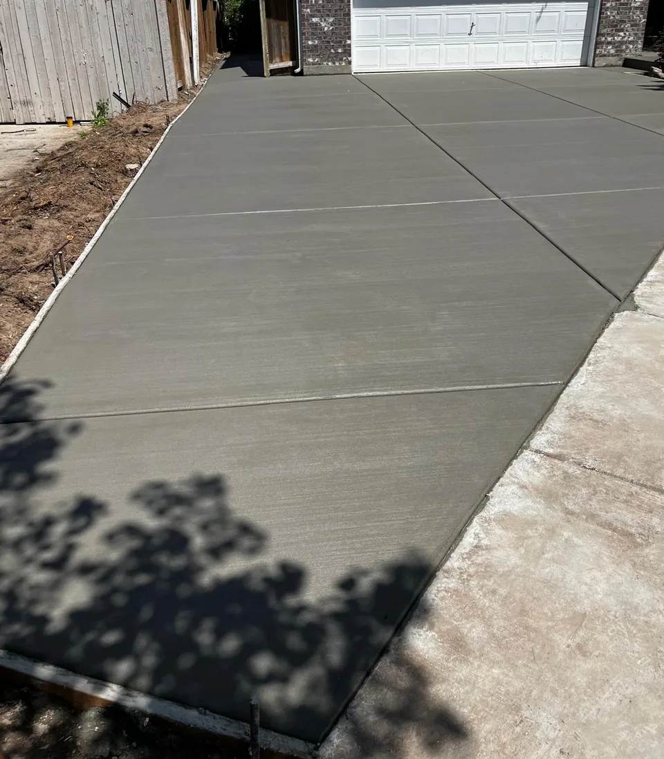 New broom-finished concrete driveway and side access