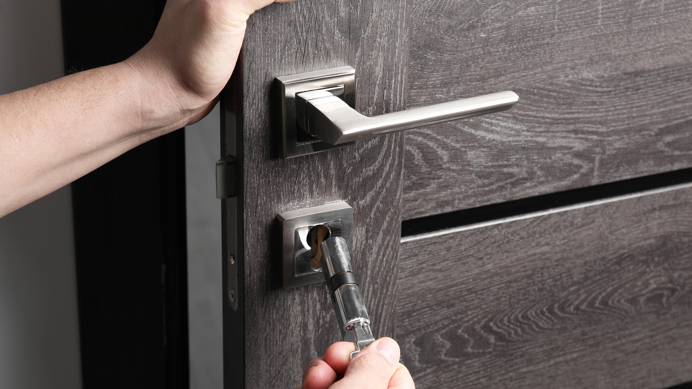 Changing Core of Door Lock Indoors, Closeup Changing Core of Door Lock Indoors, Closeup