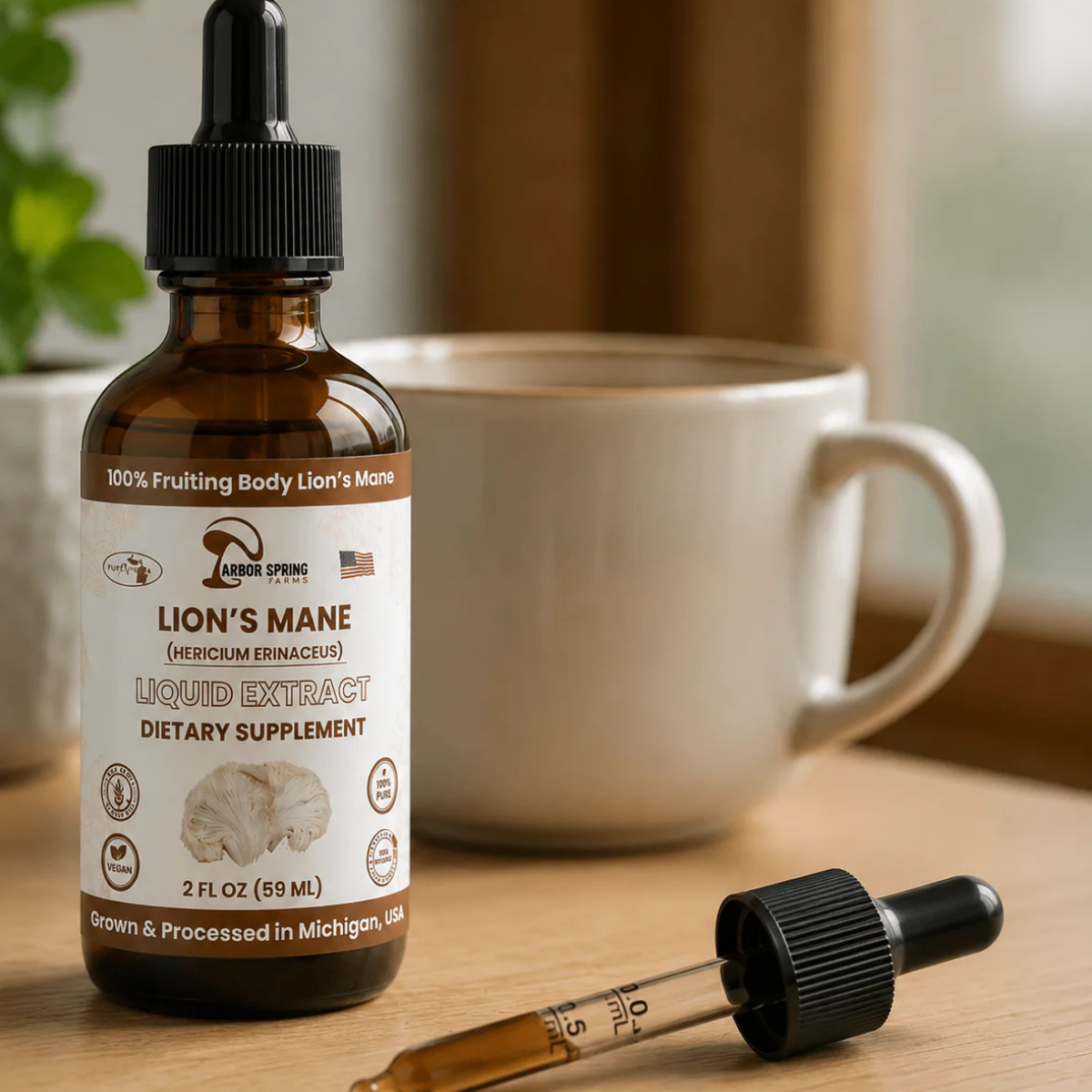 Lion's Mane tincture dropper added to a morning coffee