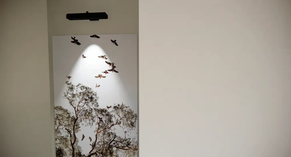 Illuminated artwork at the stair landing