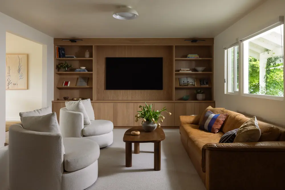 Stone + Oak Residence living room with custom oak built-ins and lounge seating