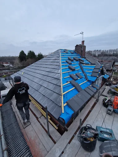 Newly laid roof with clean ridge tiles