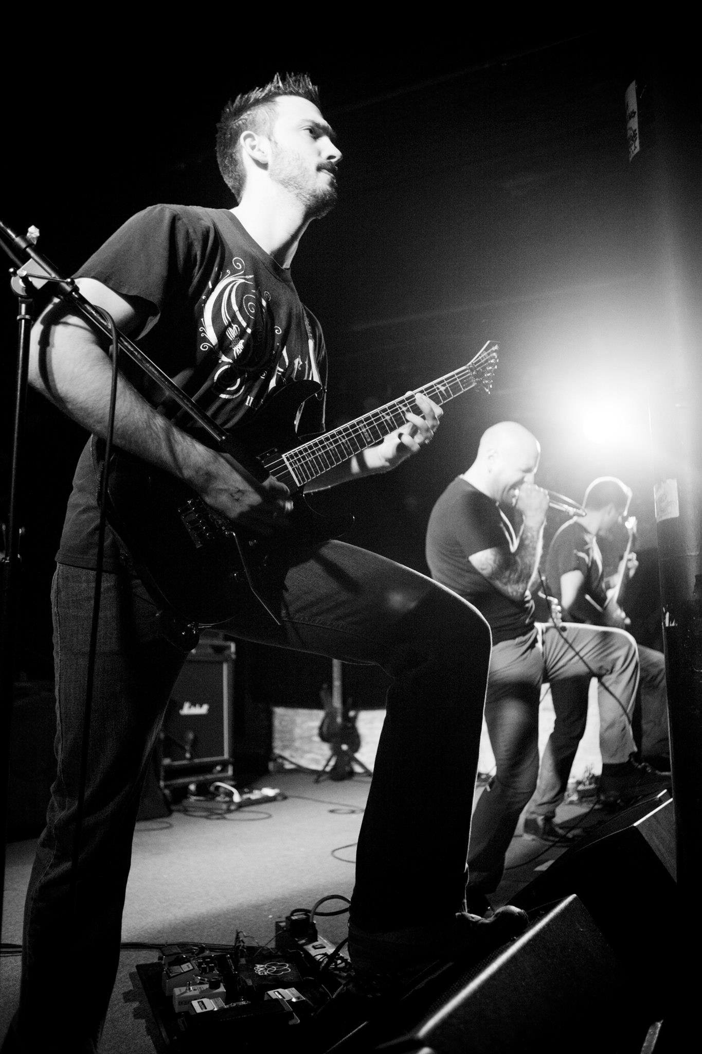 Matt Seely playing guitar live on stage