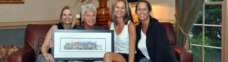 A family of four on a couch with their custom print