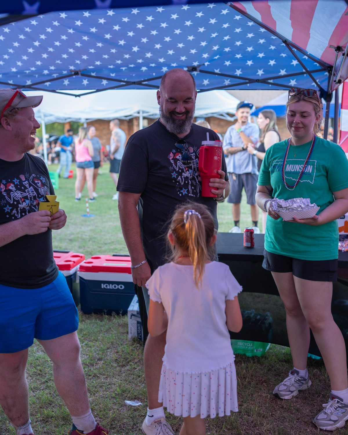 Jon Stefanick chatting with guests under the tent