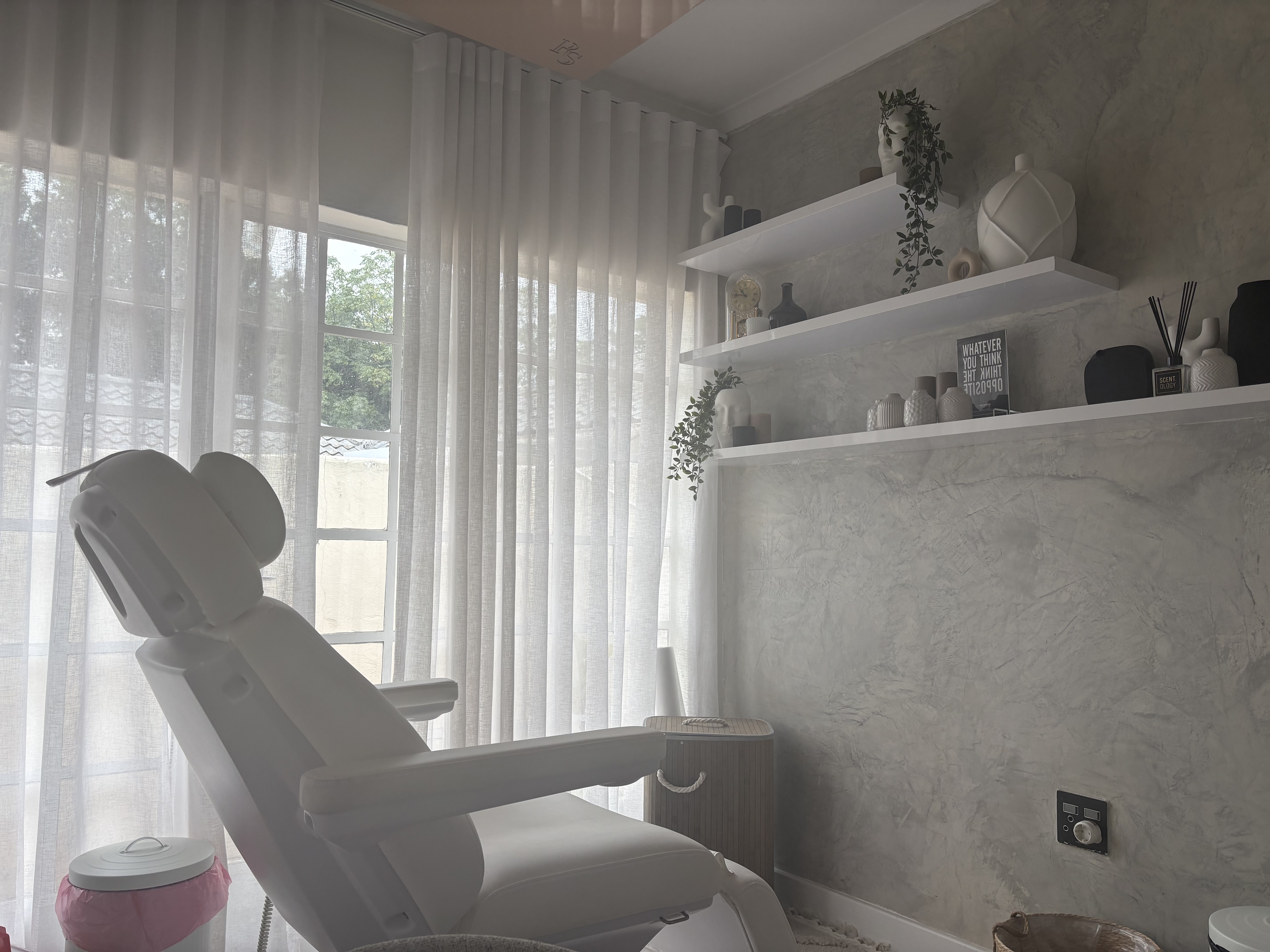 Elegant aesthetic clinic treatment room Radiant Secrets Illovo Johannesburg skin booster