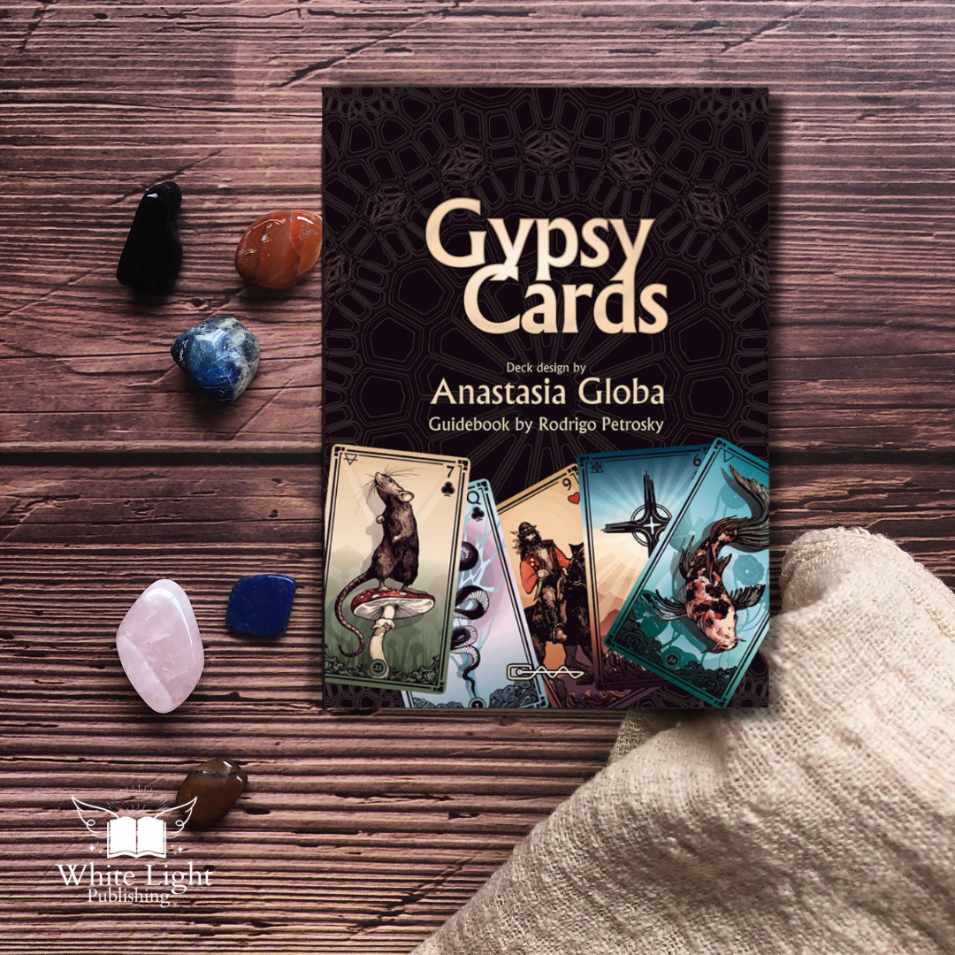 The Gypsy Cards on a wooden background with a natural cloth 