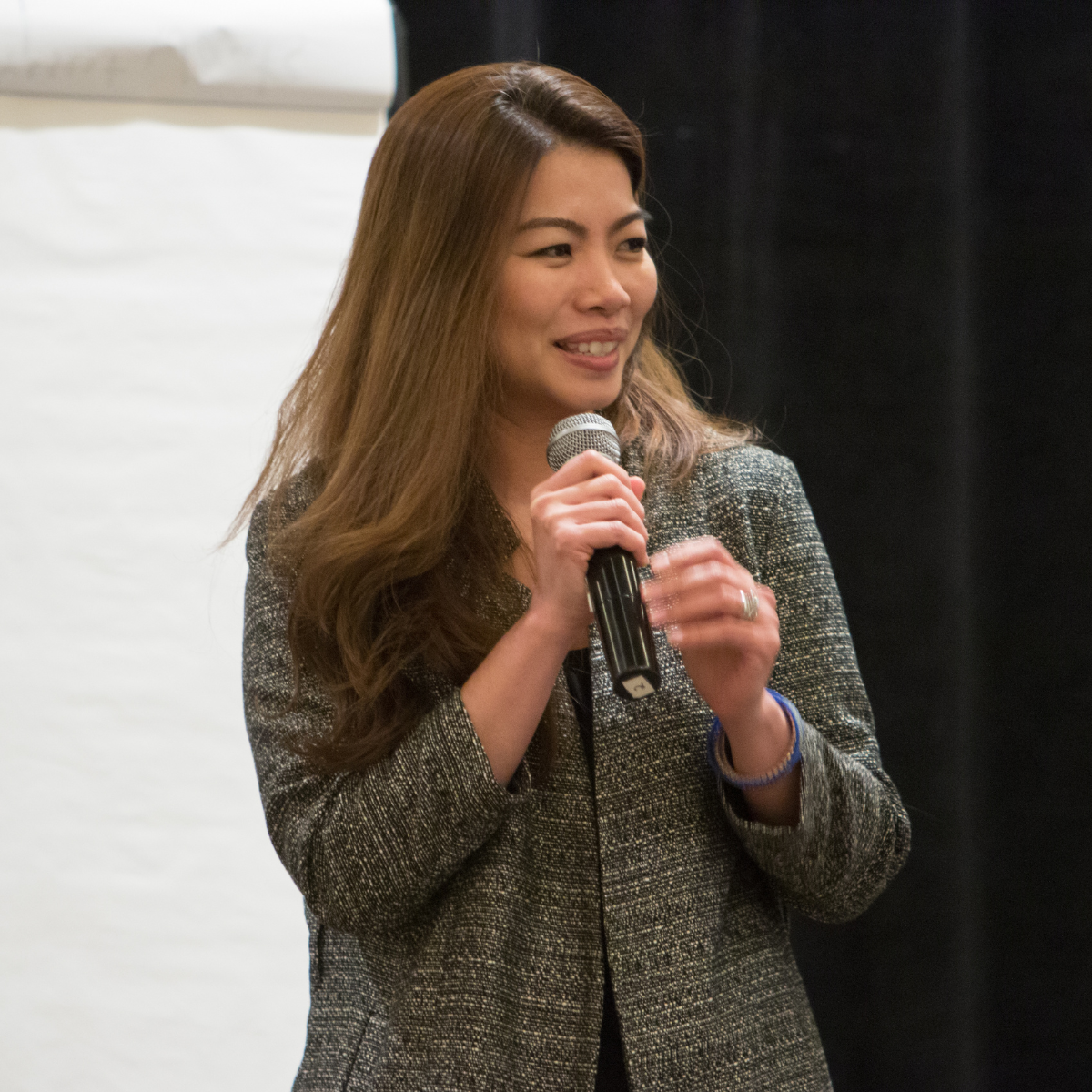 Nannapat Sage with microphone