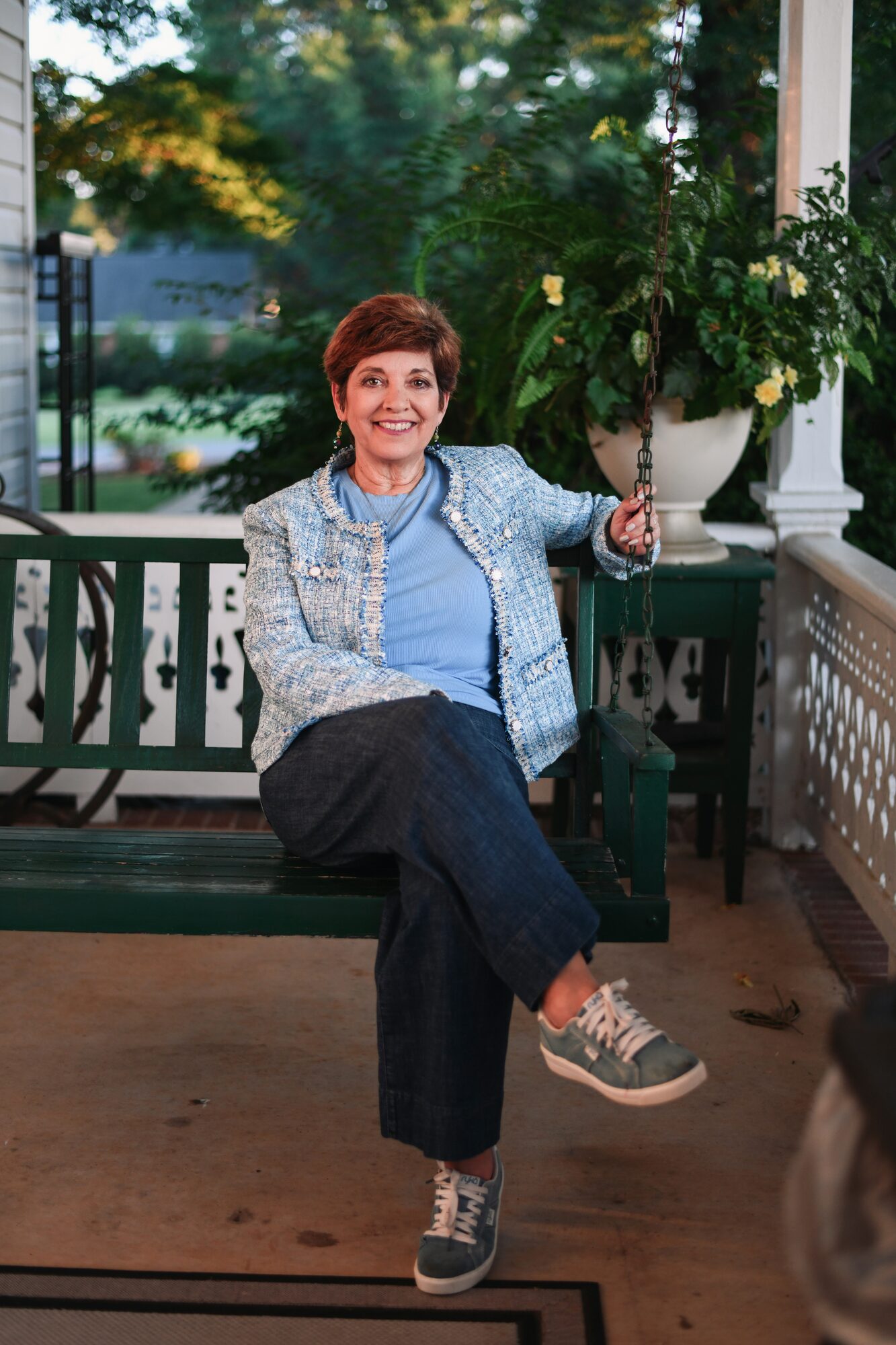 MaryAnn Molloy relaxing on a porch, ready to chat