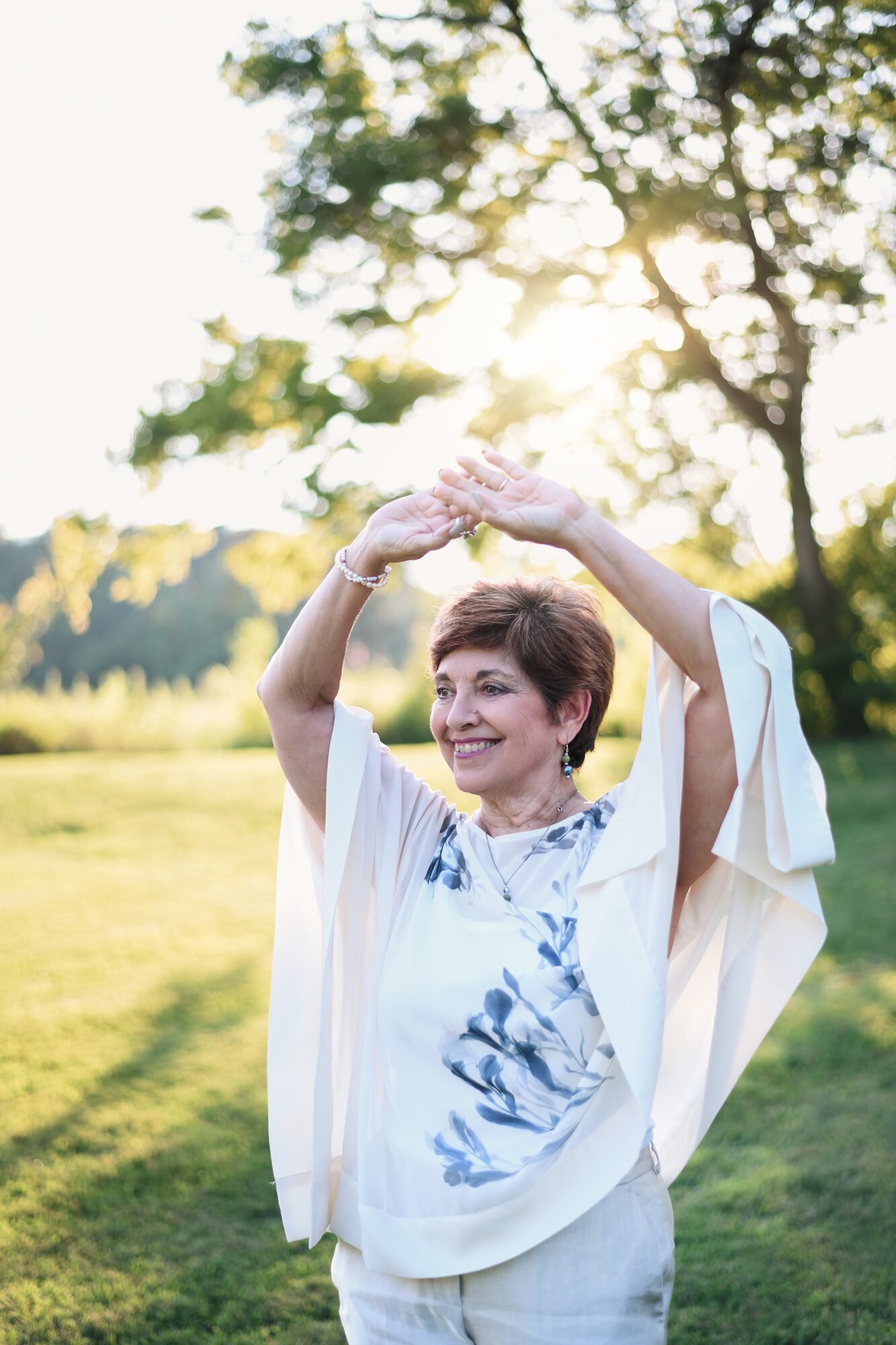 MaryAnn Molloy, arms raised in motion