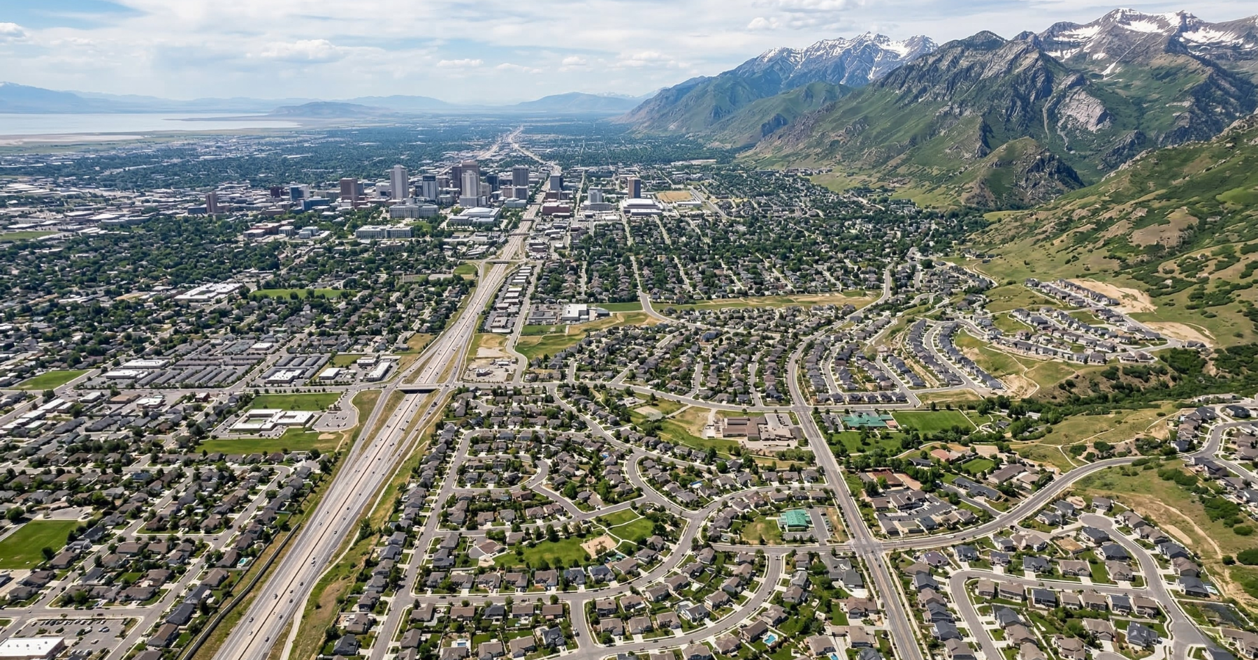 Aerial view of the Wasatch Front mountains showcasing residential neighborhoods from Ogden to Provo, Utah. Aerial view of the Wasatch Front mountains showcasing residential neighborhoods from Ogden to Provo, Utah.