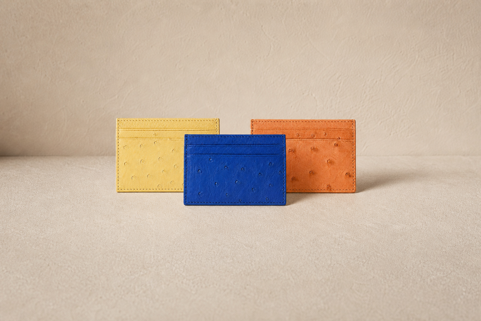 Merit House ostrich leather cardholders in Atlantic, Ember and Saffron