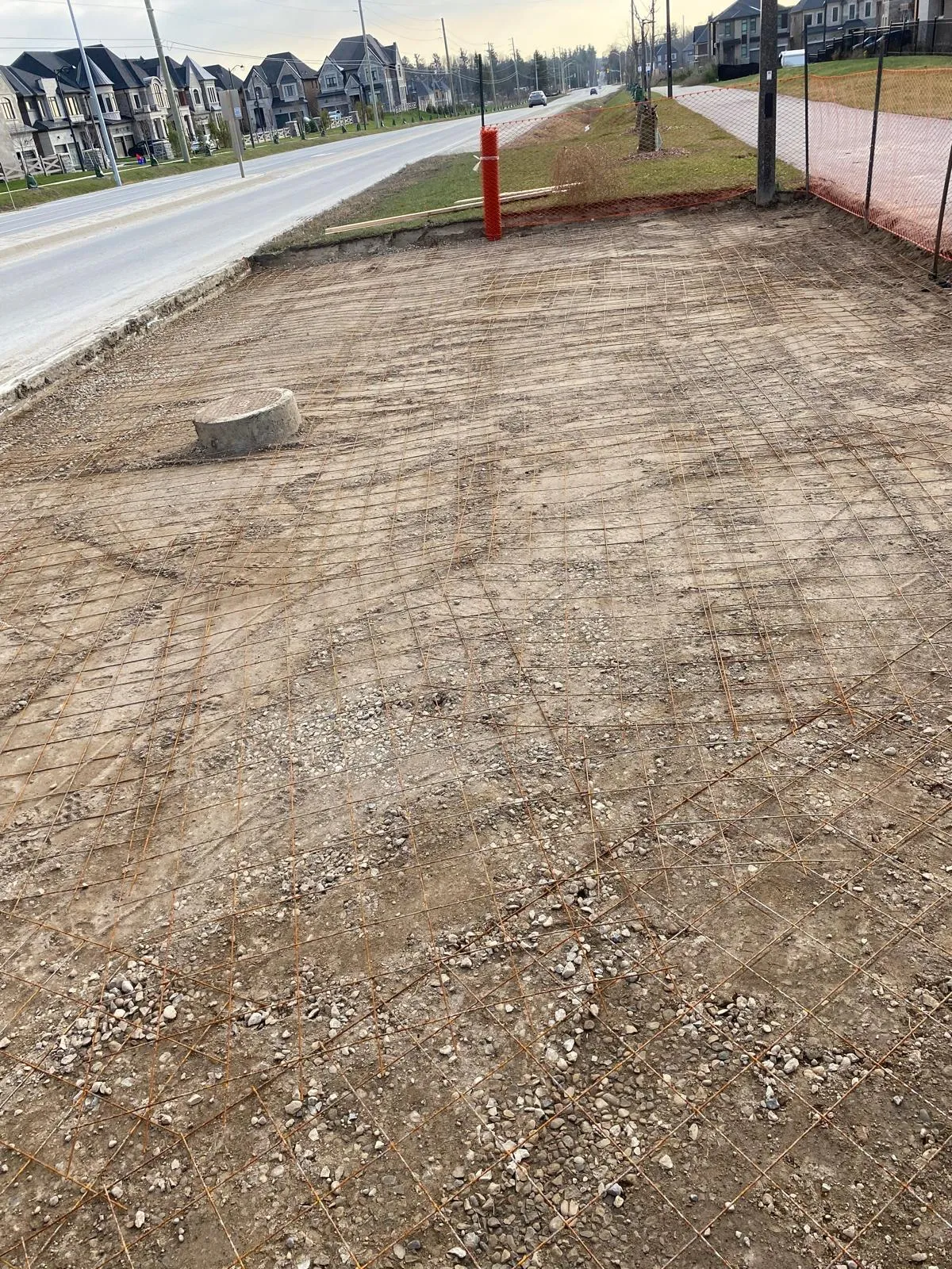 Finished concrete walkway and curb on a GTA property