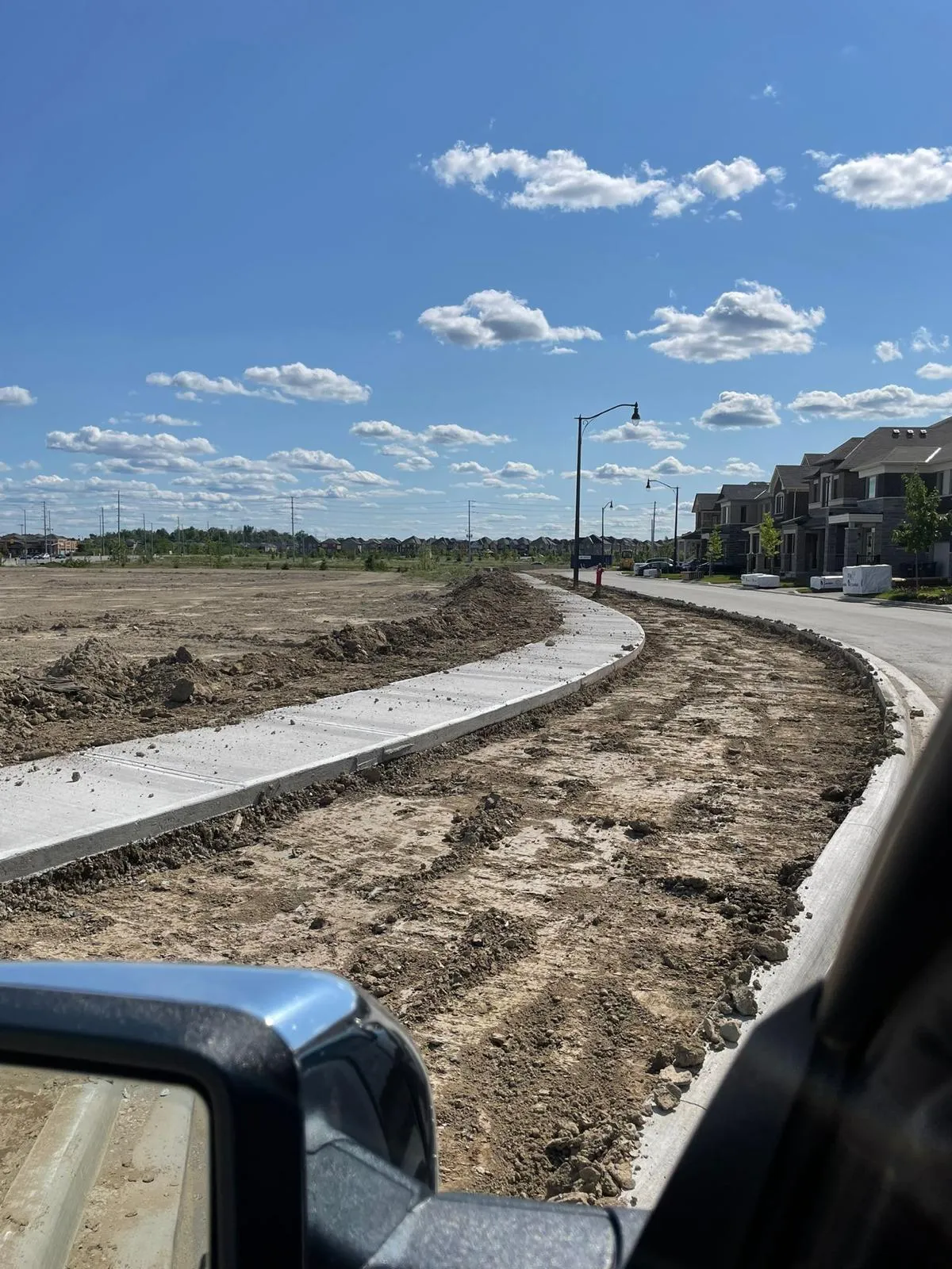 Poured concrete curb and gutter on a GTA development