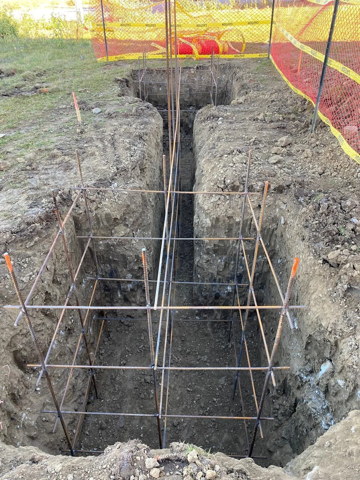 Commercial site excavation, trenching, structural foundation prep, demolition, and material hauling.
