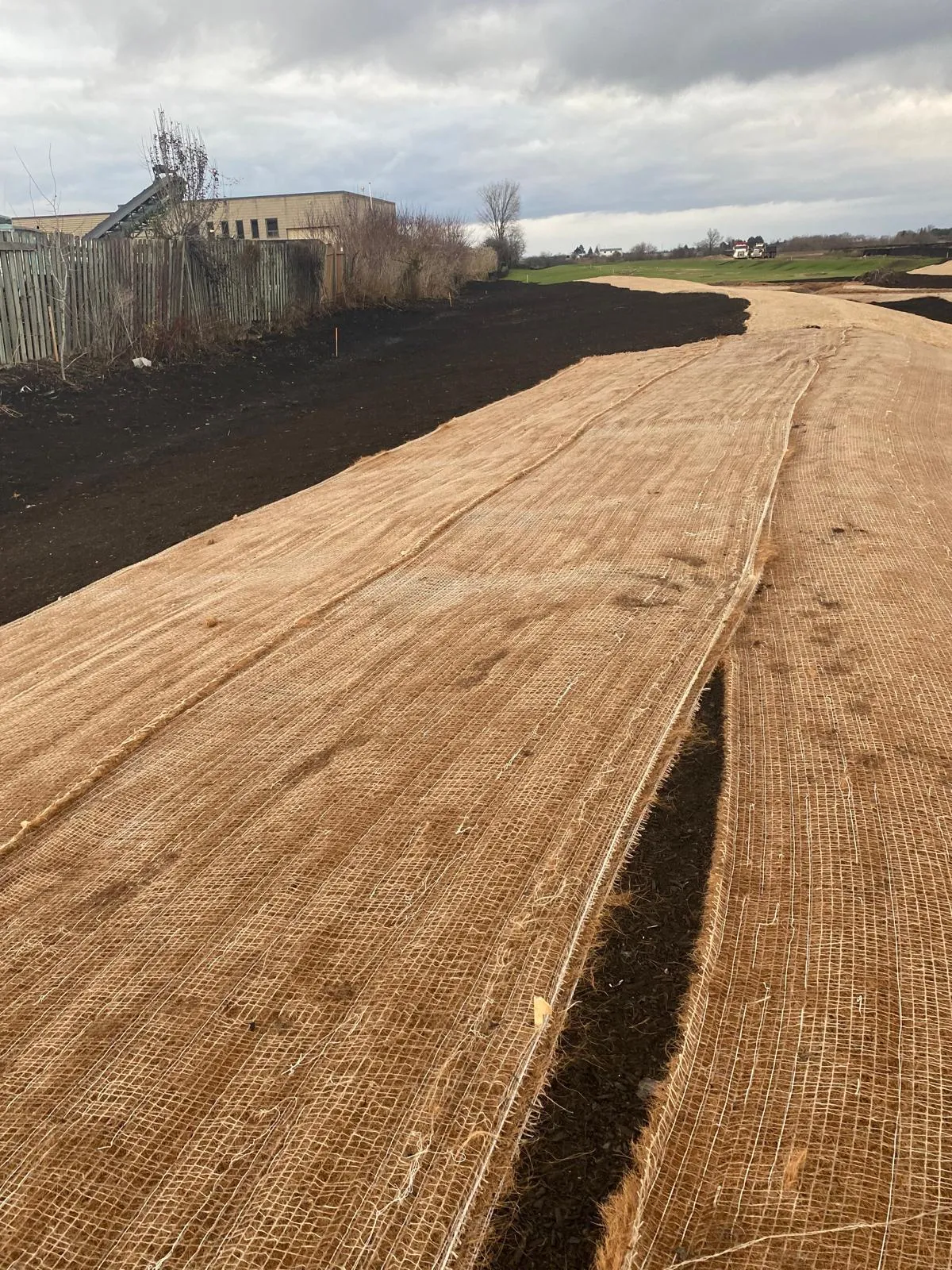 Erosion control matting installed along a sloped channel in the GTA