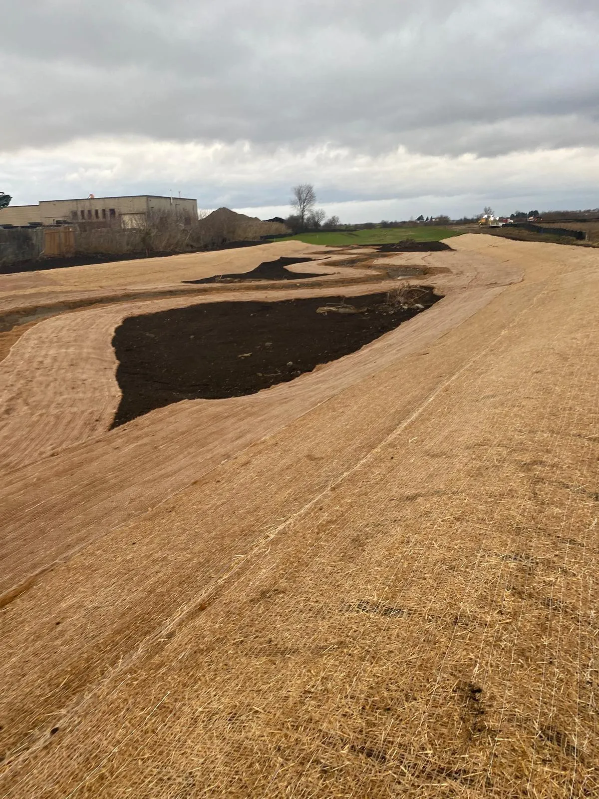 Coir erosion control blanket along a stormwater channel in the GTA