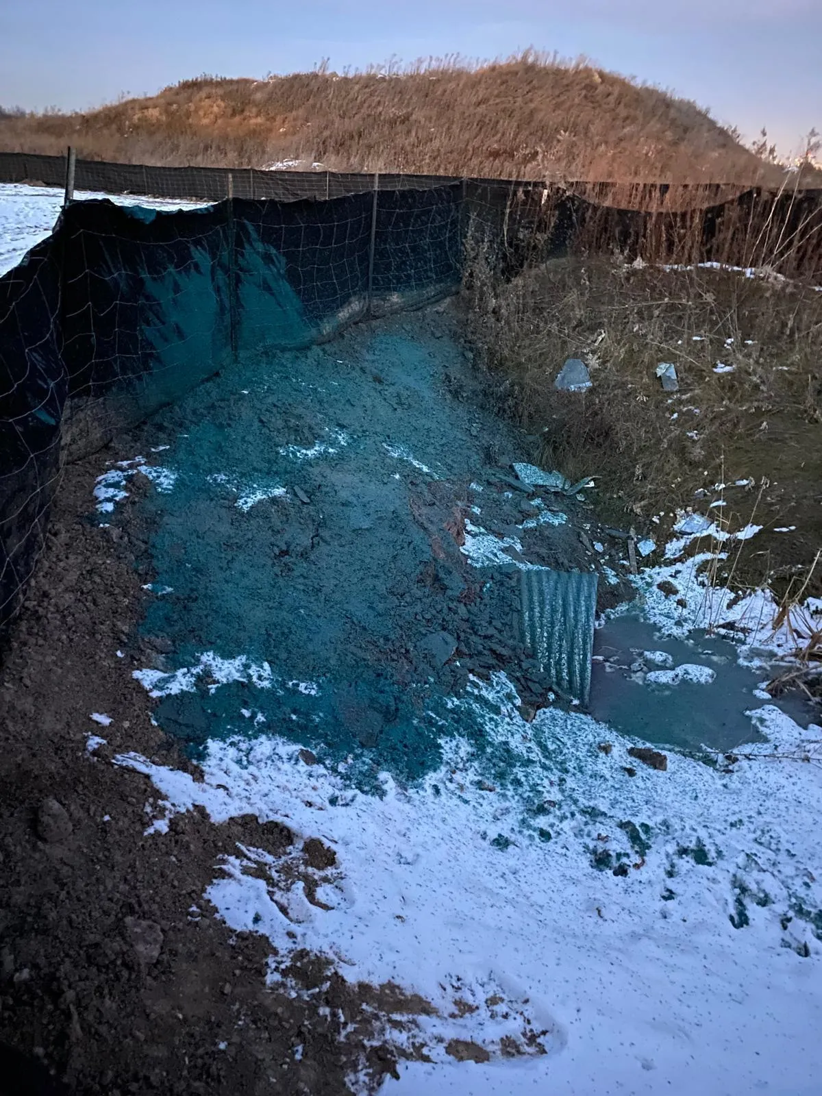 Spray-on hydroseeding cover on a newly graded commercial lot in the GTA