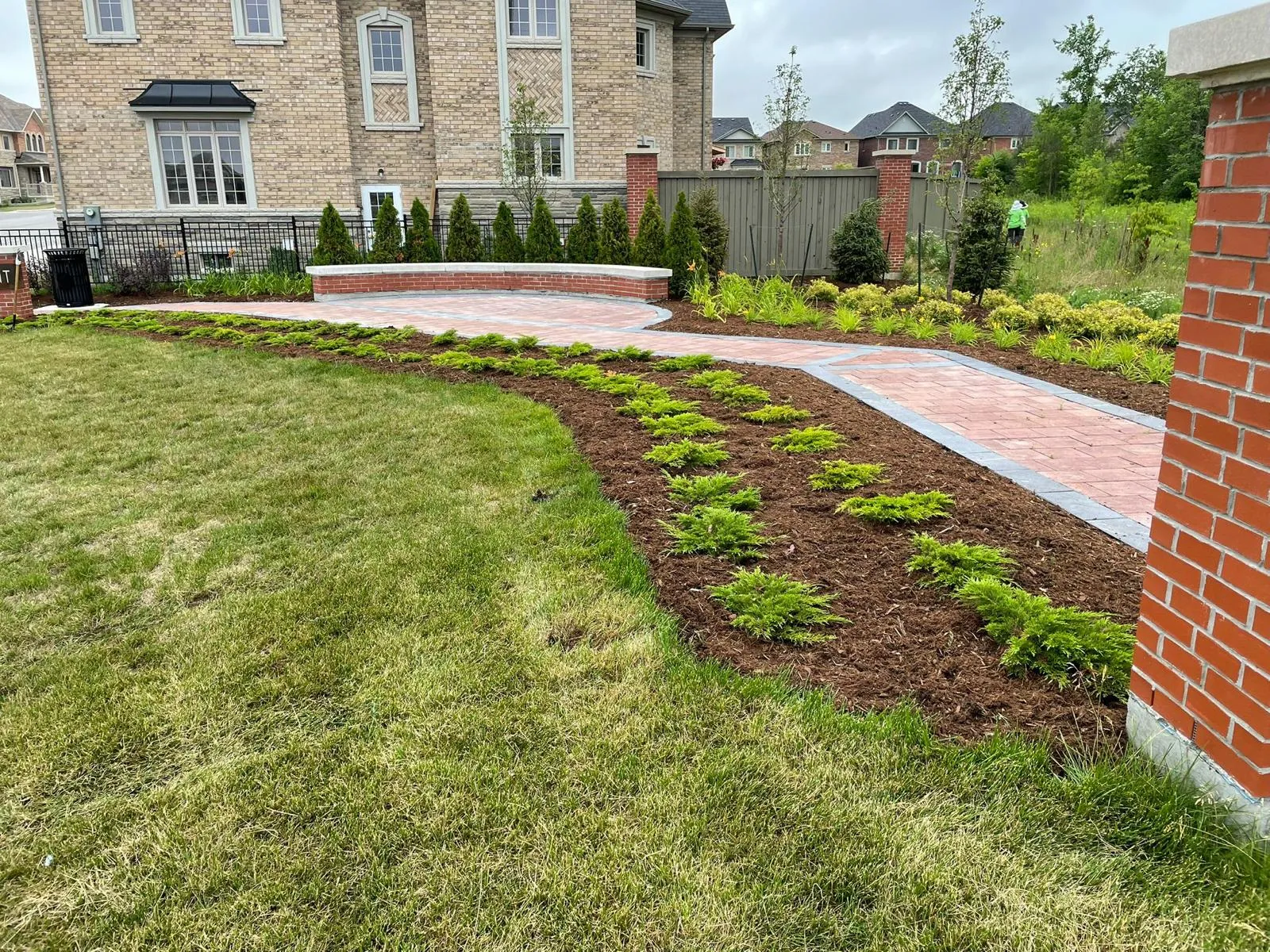Completed interlocking paver courtyard and retaining wall in the GTA