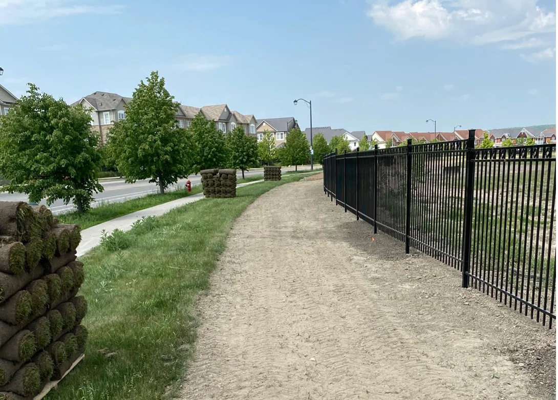 Commercial and municipal fencing including heavy chain-link, ornamental steel and aluminum, acoustic wood, and vinyl perimeter systems.