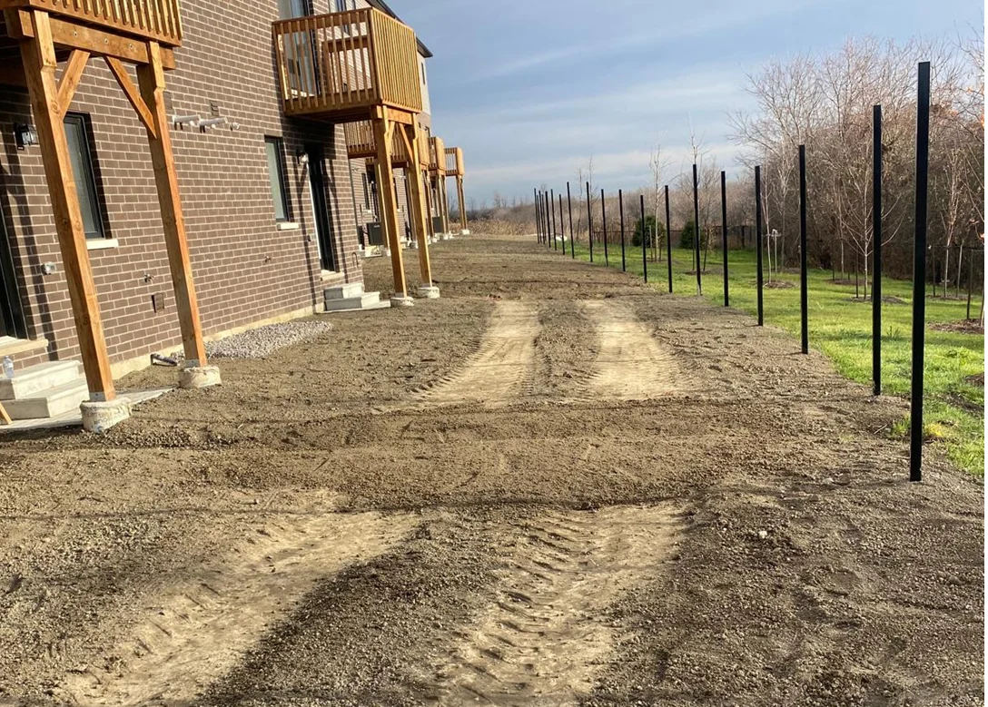 Sod rolls being laid along a commercial boulevard in the GTA
