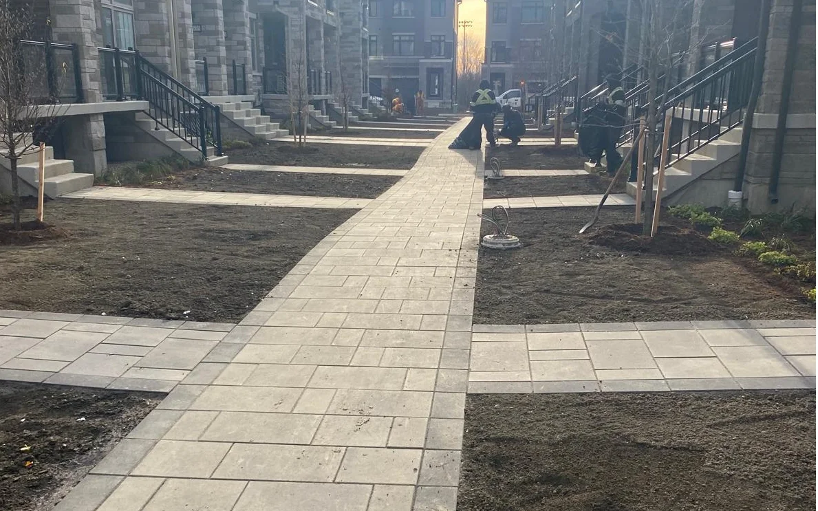 Finished interlock paver walkway and retaining wall on a GTA commercial site
