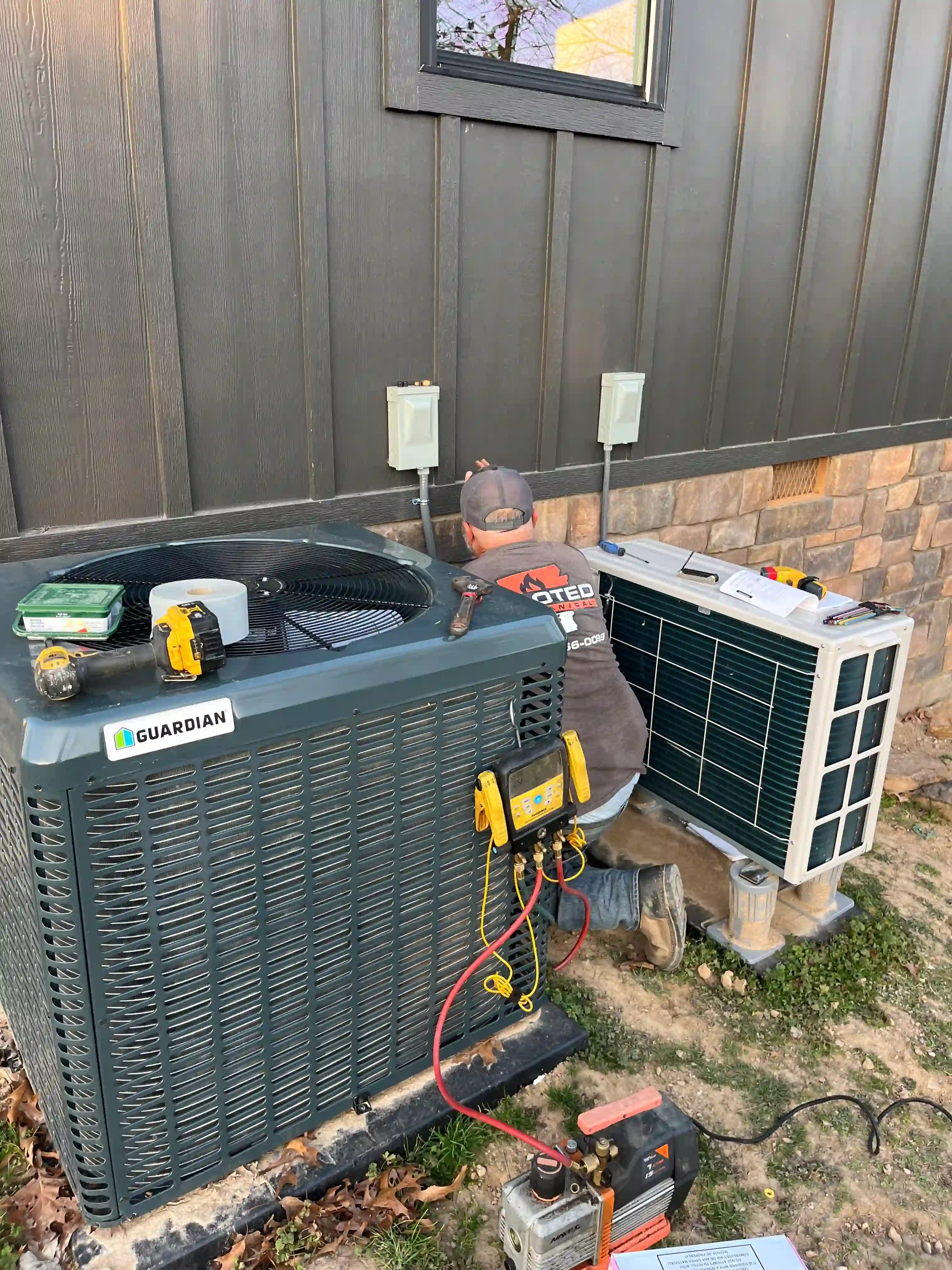 HVAC technician performing heating system diagnostics in Rogers Arkansas