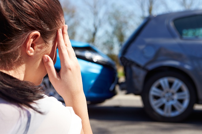 Women in head pain from car accident