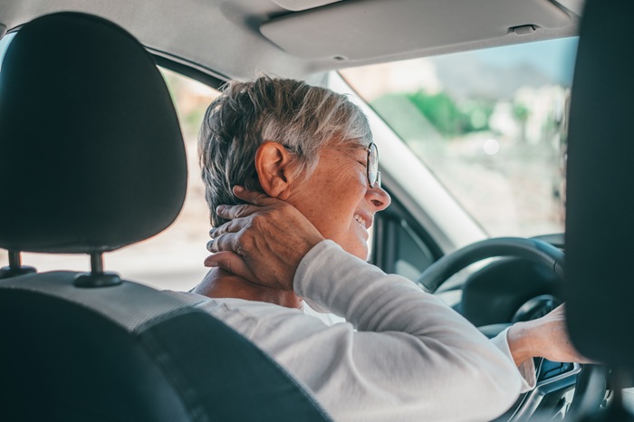 mid age women with neck pain after a car accident