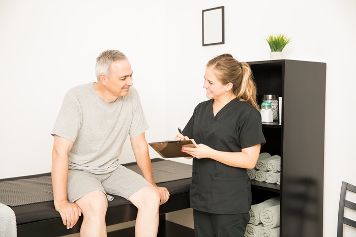 Chiropractor reviewing spinal health