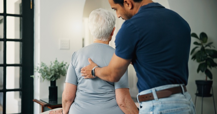 MS patient receiving gentle chiropractic adjustment in Tucson AZ