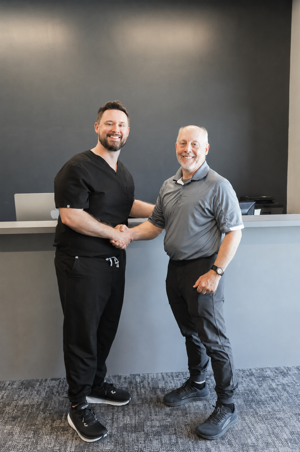 Dr Sams and Dr Hall shaking hands