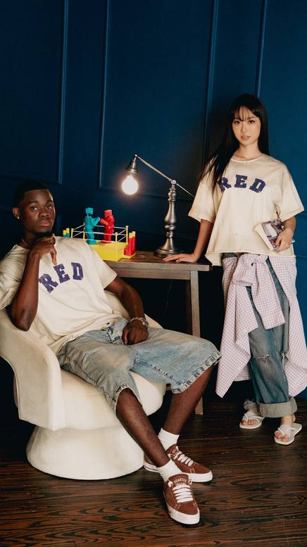 Two models in a deep-blue styled interior