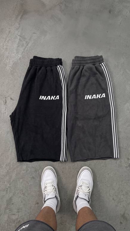 Flat lay of Inaka shorts with white sneakers