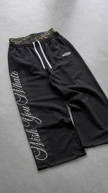 Flat lay of black Wish U Well sweatpants