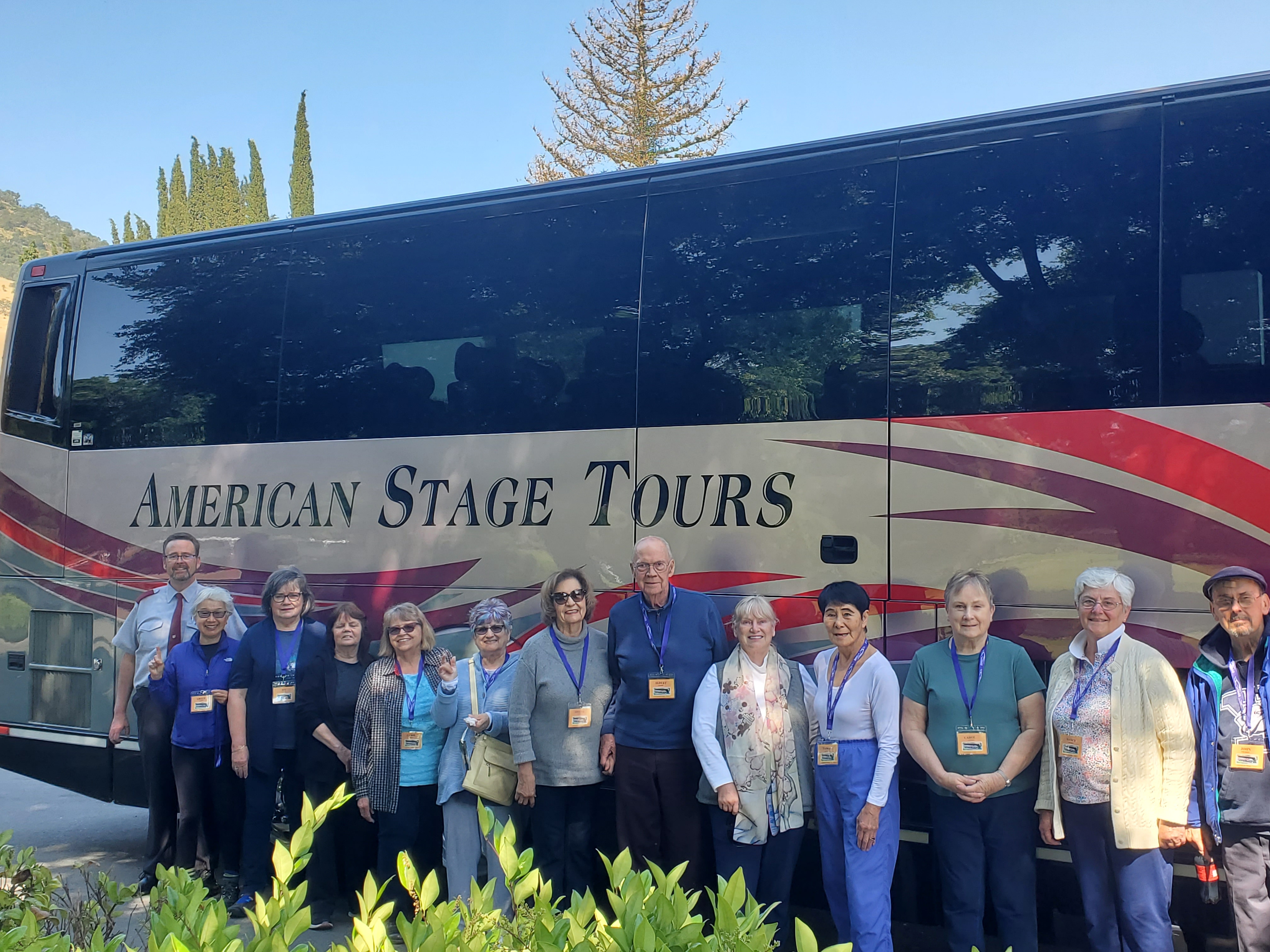 American Stage Tours travelers gathered beside their coach.