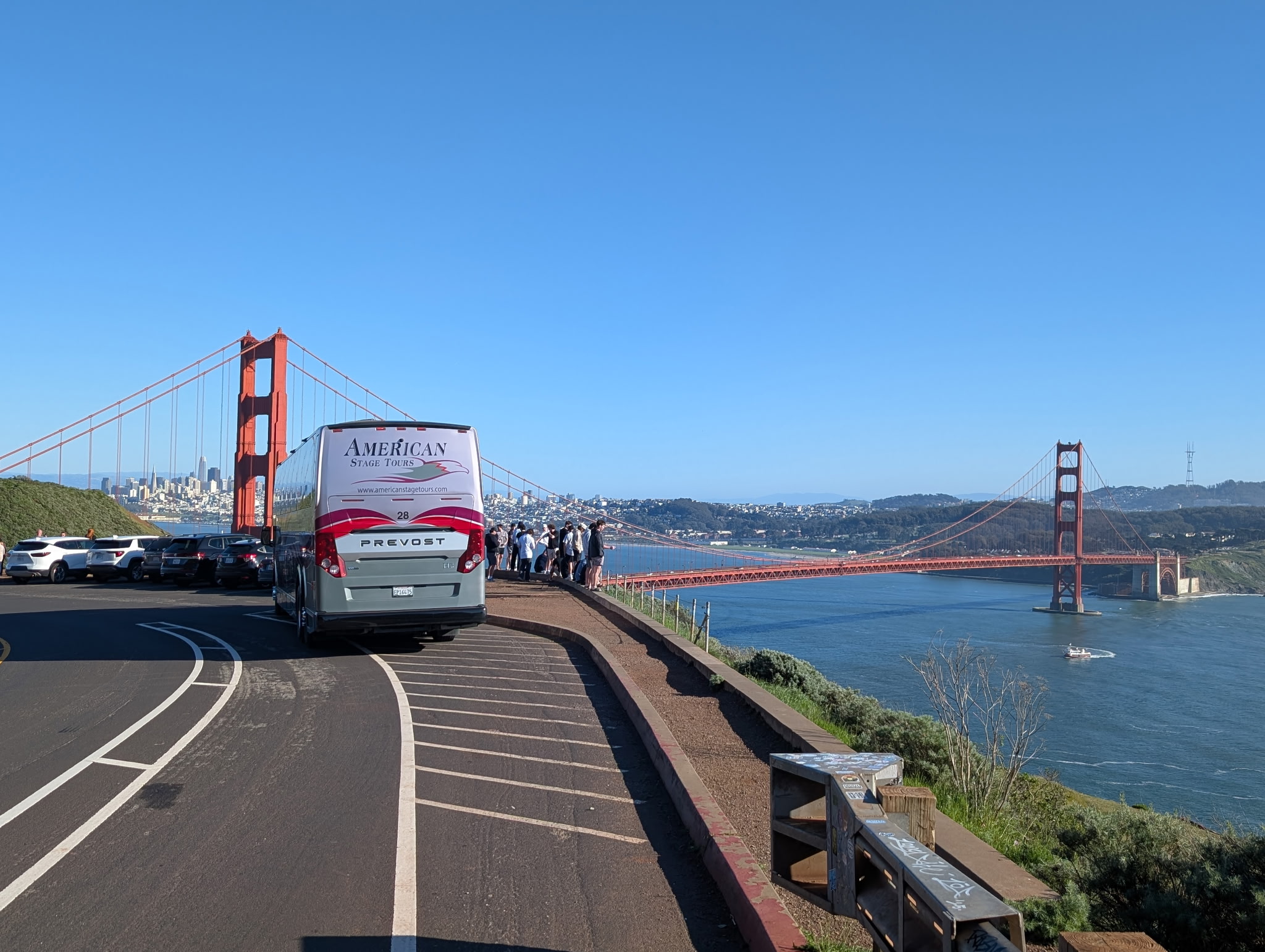 An American Stage Tours coach parked at the Golden Gate Bridge overlook.