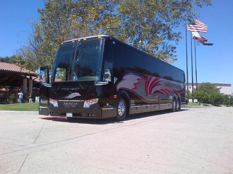 An American Stage Tours coach parked on tour.