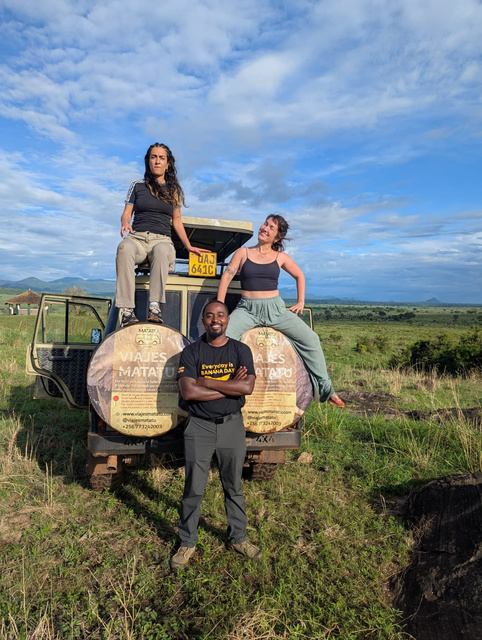 Travellers aboard a safari Land Cruiser in Uganda