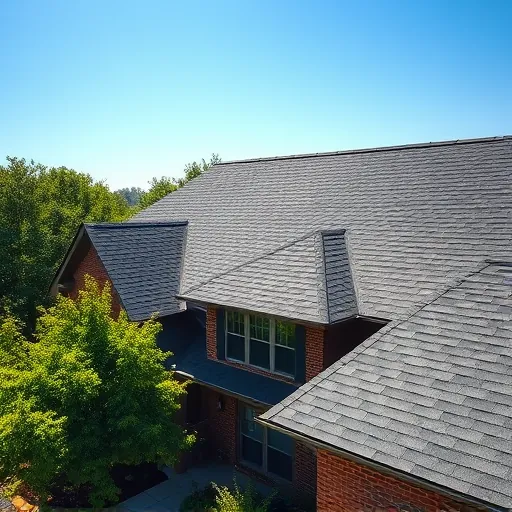 Completed roofing project in Cahaba Heights AL featuring dark charcoal gray shingles and vibrant green landscaping.