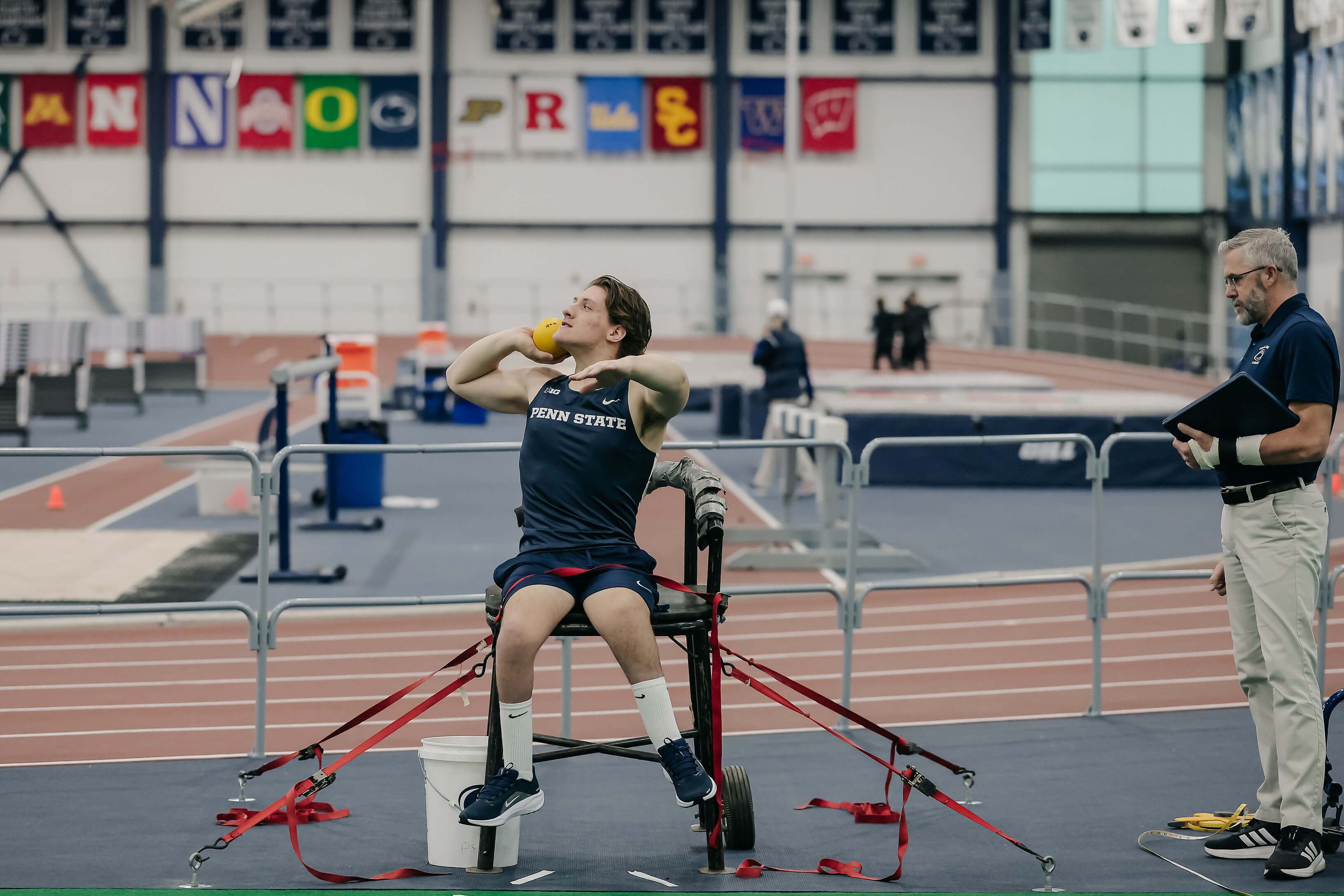 Penn State adaptive athlete training with coach during track and field practice