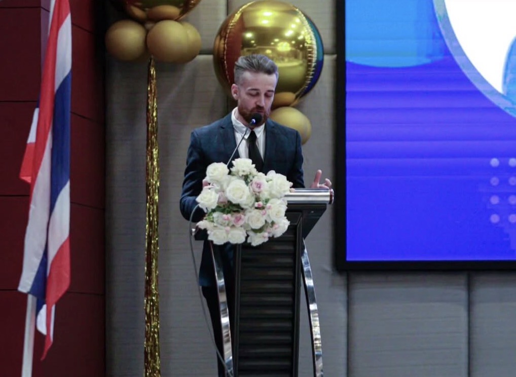 James speaking to audience
