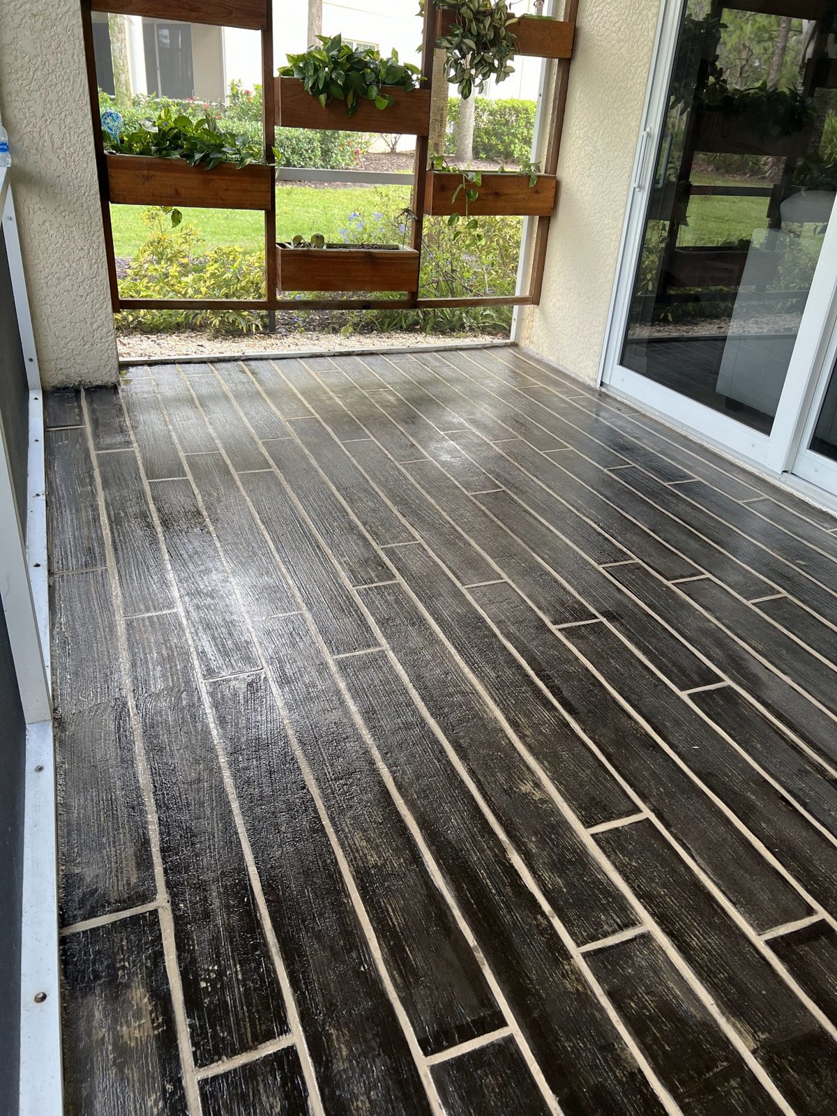 Wood-look coated concrete lanai floor