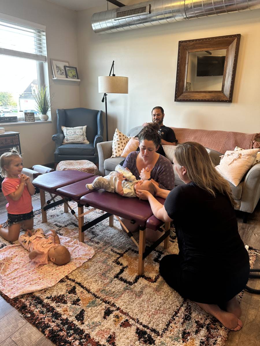 Infant receiving gentle chiropractic care at Firm Foundation Chiropractic