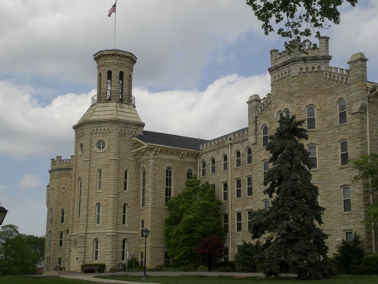 Blanchard Hall, a limestone building with a tall tower, on the Wheaton College campus in Wheaton, Illinois