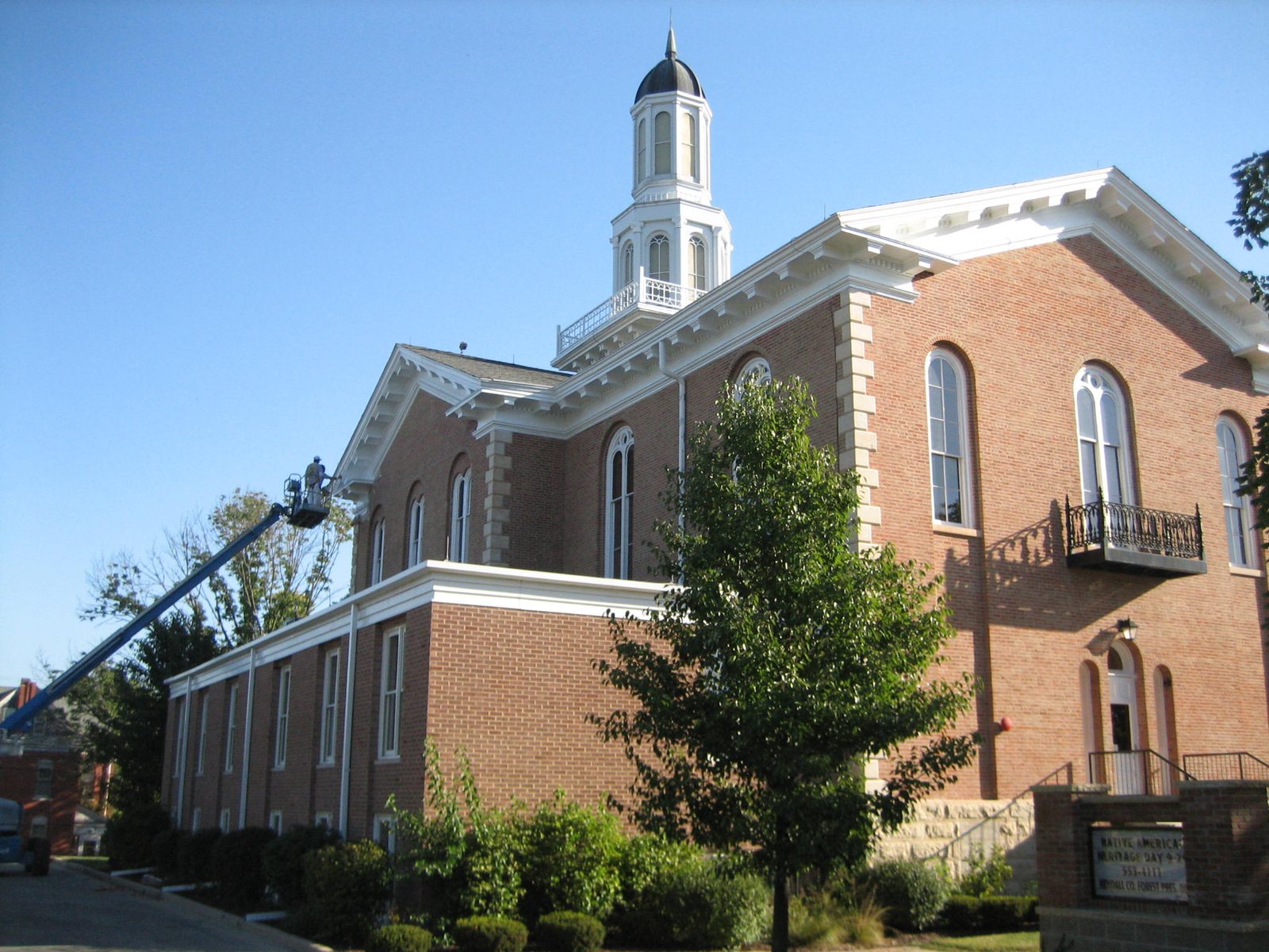 The red brick Kendall County Courthouse with a white cupola in Yorkville, Illinois