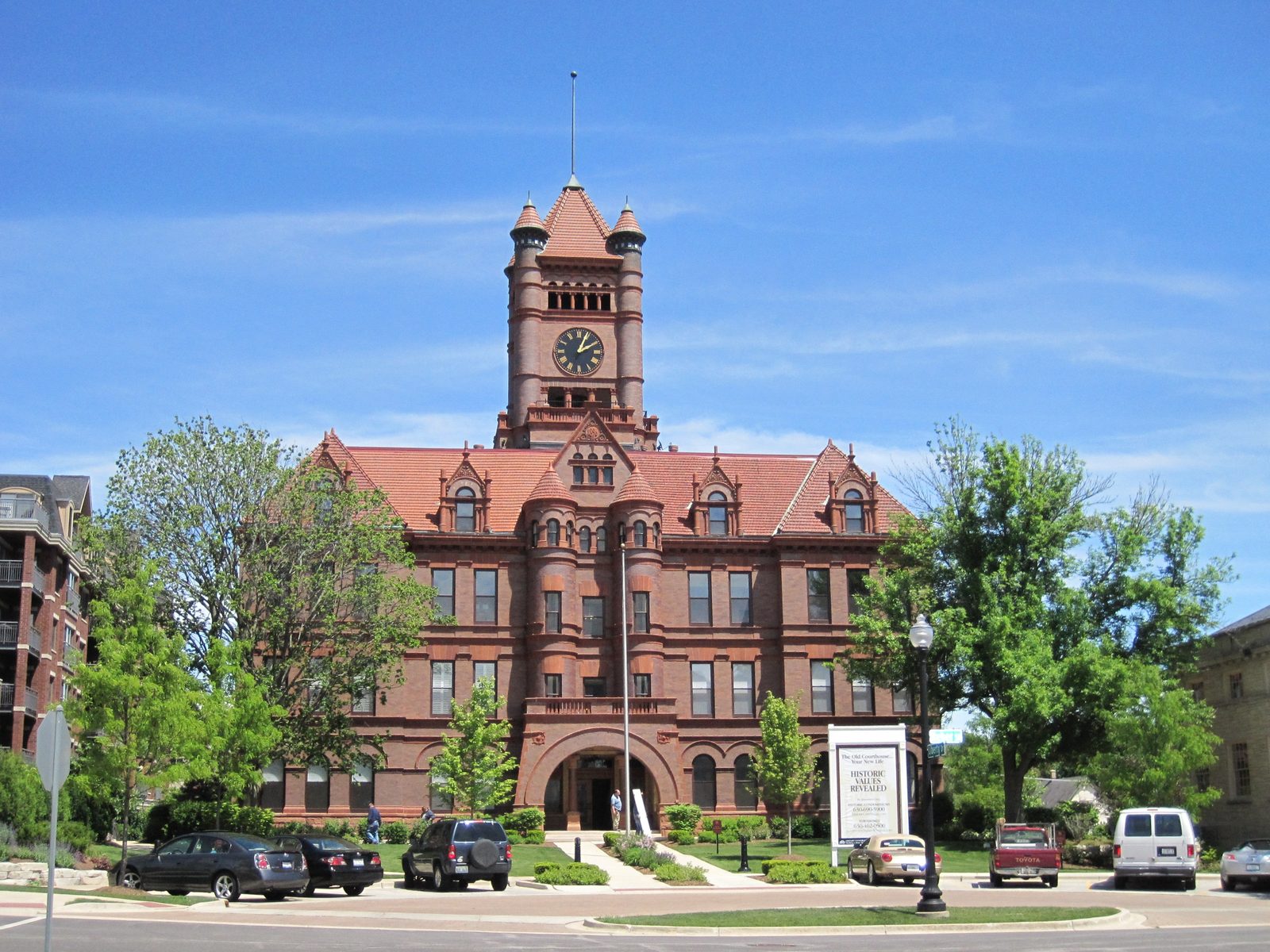 The historic red-brick DuPage County Courthouse building with its clock tower in Wheaton, Illinois