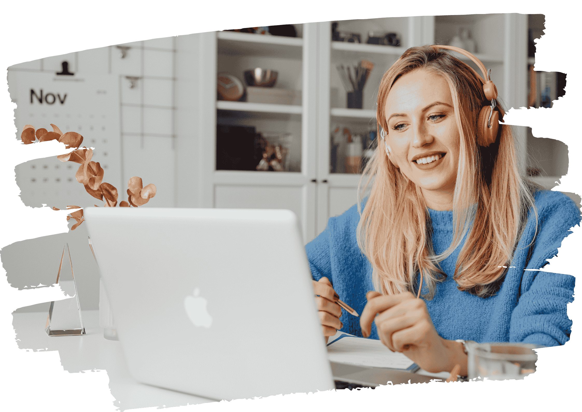 Confident woman smiling while working on laptop, representing clarity and self-trust after overcoming people-pleasing 